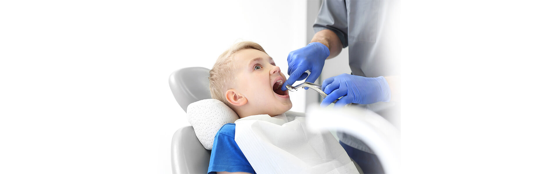 dentist performing procedure on child